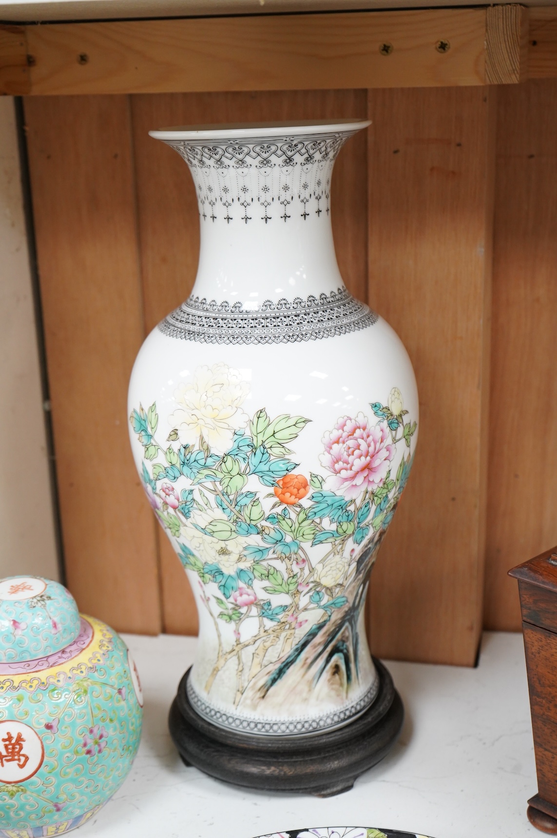 A collection of Chinese ceramics to include enamelled ginger jar and cover, floral plate and a vase, largest 40cm high